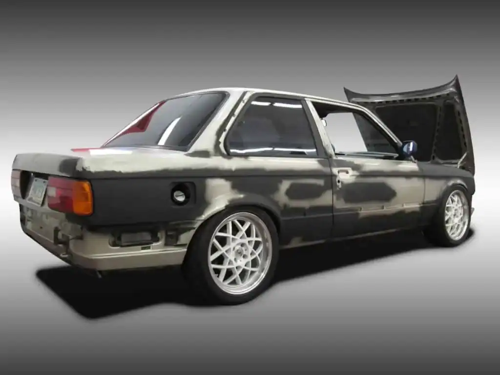 Side view of beat up BMW
