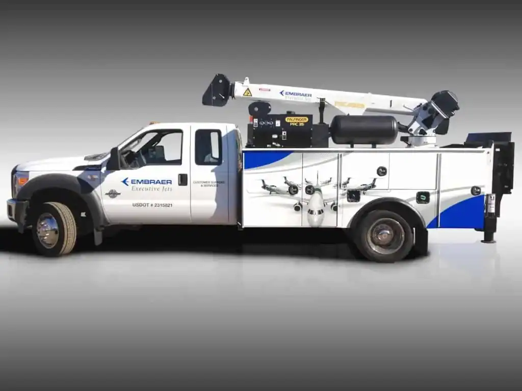 Vehicle Wraps...Our work, before and after - 4 16 Embraer fleet work truck