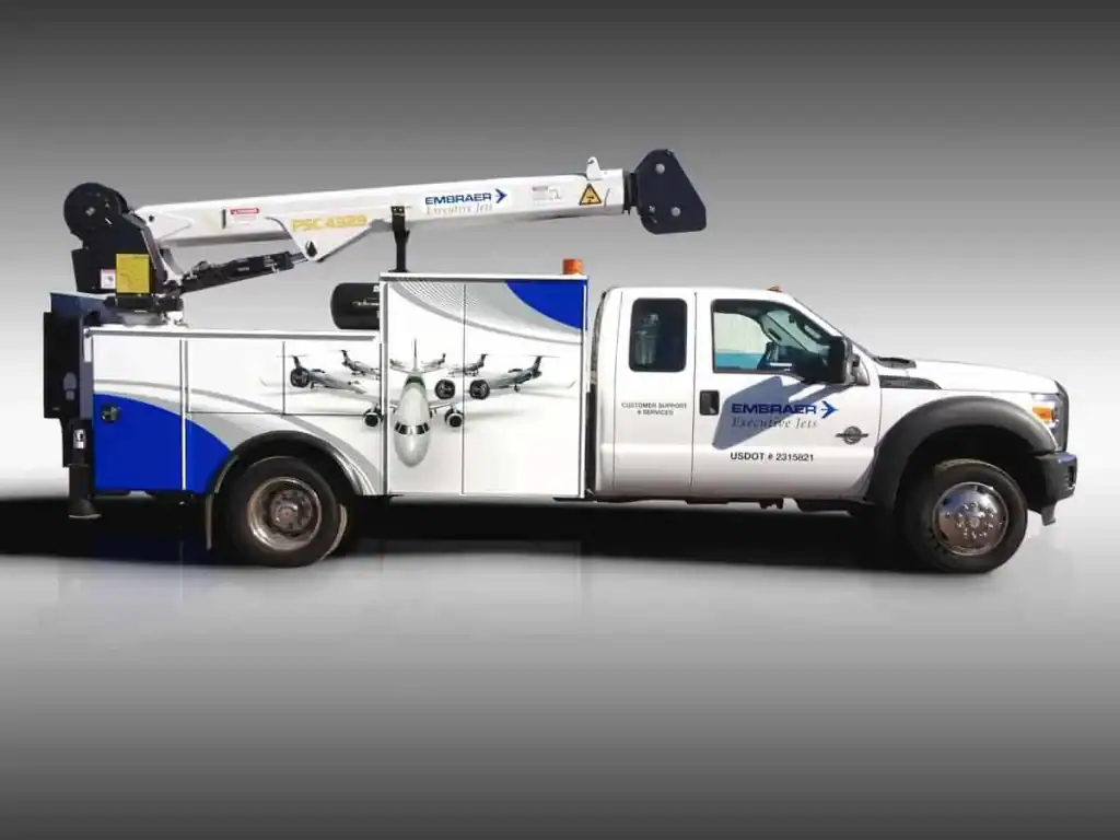 Vehicle Wraps...Our work, before and after - 4 14 Embraer Work Truck Wrap